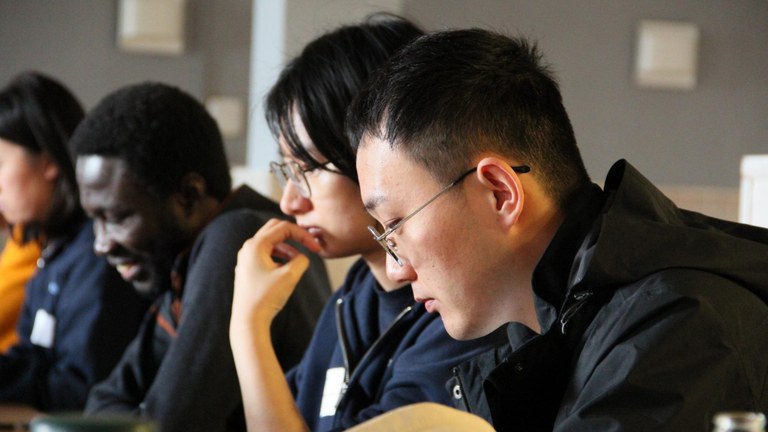 Participants working together on their Summer School projects